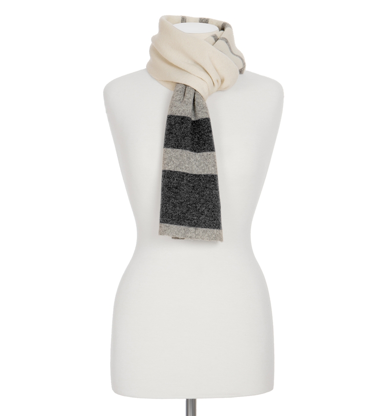 A grey and mahogany block striped faux fur scarf, on a white mannequin, on a white background.