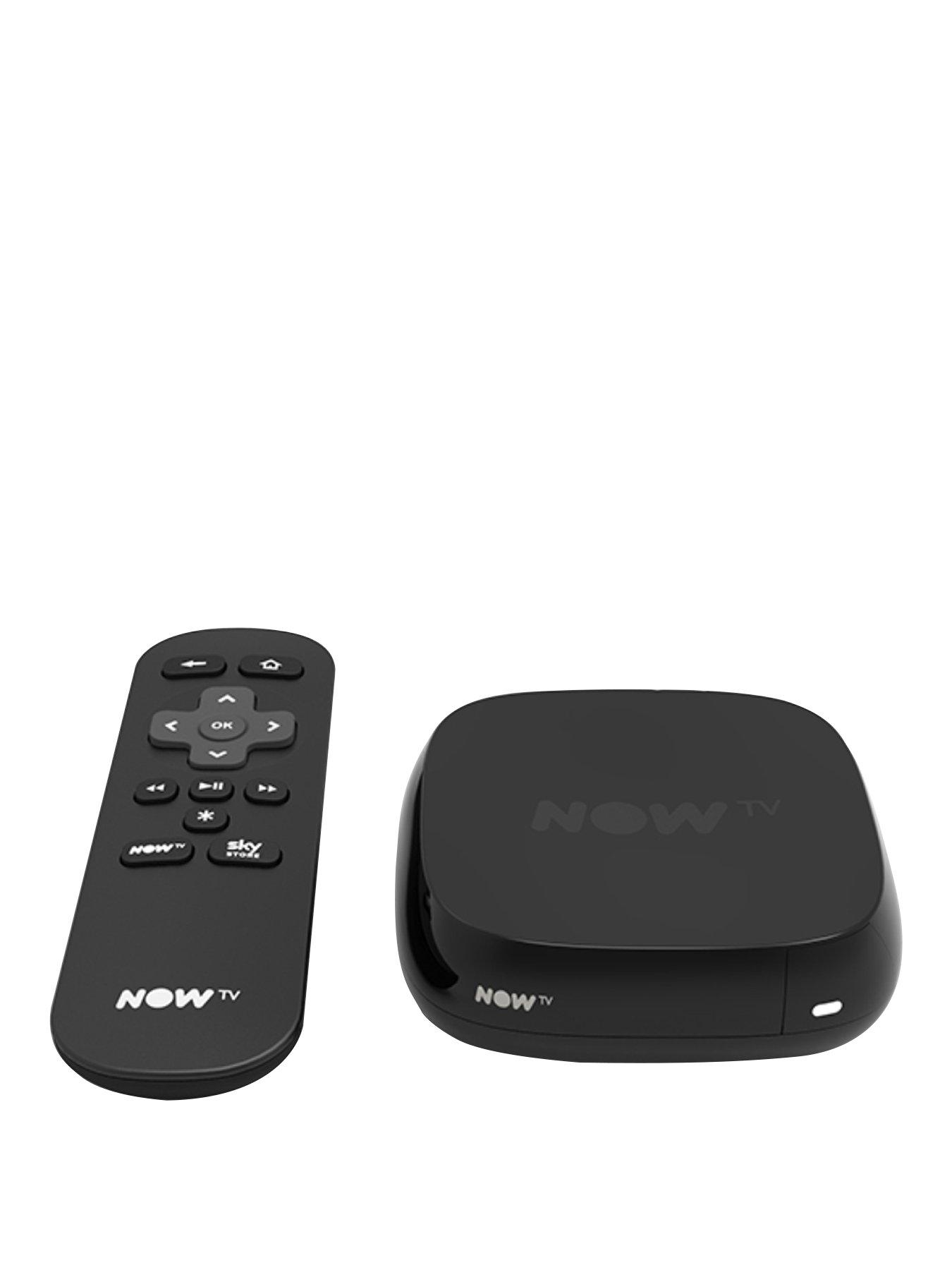 A black box that has NOW TV written in bold white writing on it next to a chunky black remote, on a white background.