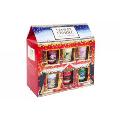 A selection of 12 small glass votive candles, in a house shaped box, on a white background.