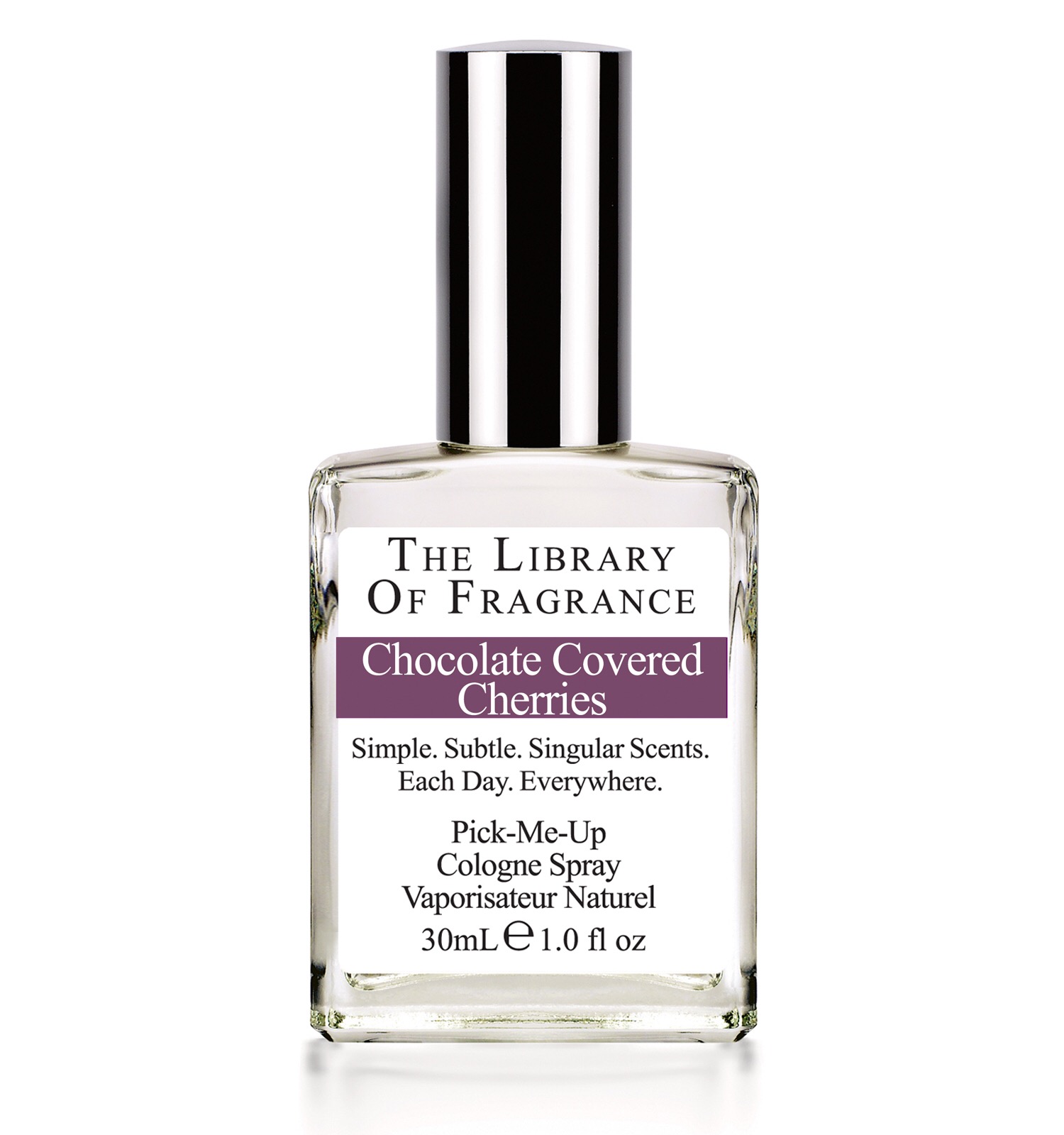 A clear glass perfume bottle with the library of fragrance written on a white label, and chocolate covered cherries on a dark strip, on a white background.