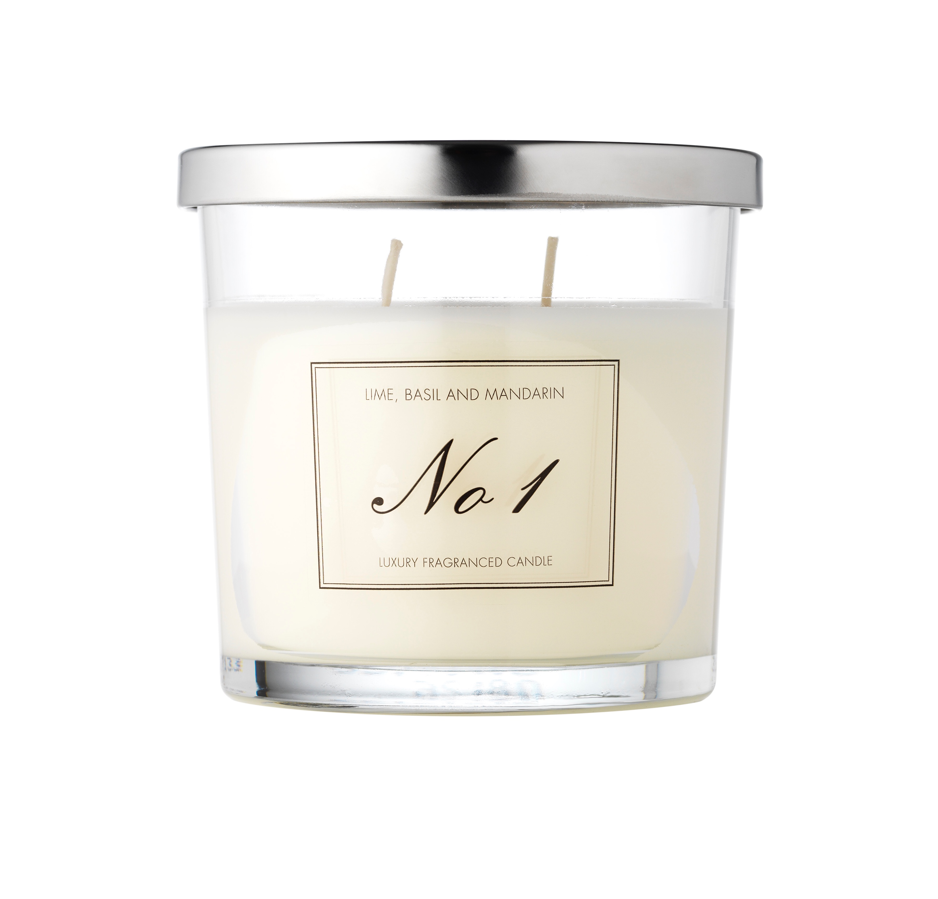 A medium glass jar full of some white coloured wax with a label that has No.1 written in large cursive black writing and Lime, Basil, Mandarin written in smaller black writing on it, on a white background.