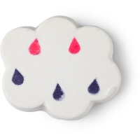 A chunky white cloud shape bath bomb that has some different coloured water droplets on it, on a white background.