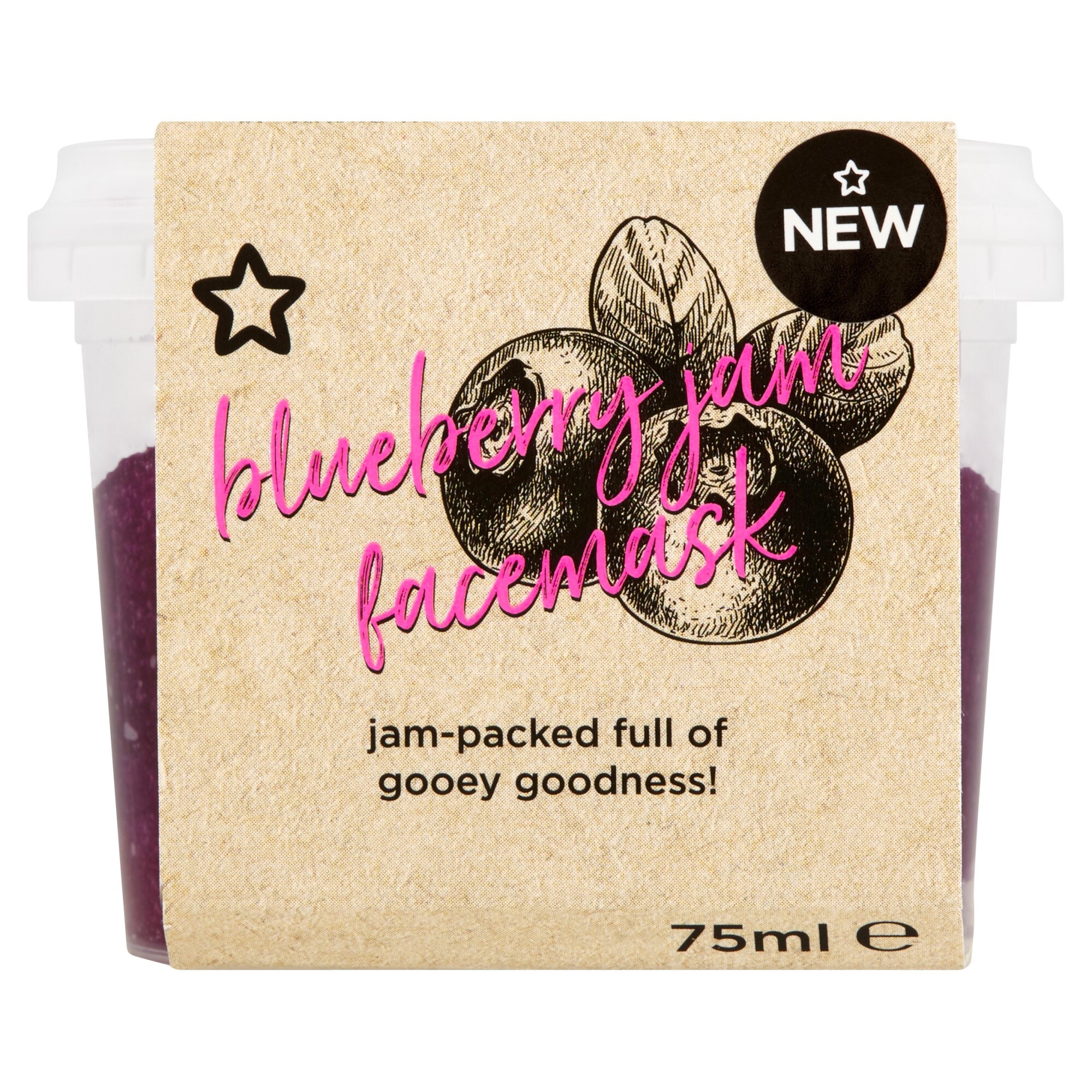 A light green square box that has a picture of a black star, Superdrug written in black cursive writing, blueberry jam face mask written in cursive pink writing, jam packed full of gooey goodness written in bold black writing, and a picture of three plump blueberries on it, on a light background.