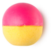 A red and yellow spherical shaped bath bomb, on a white background.