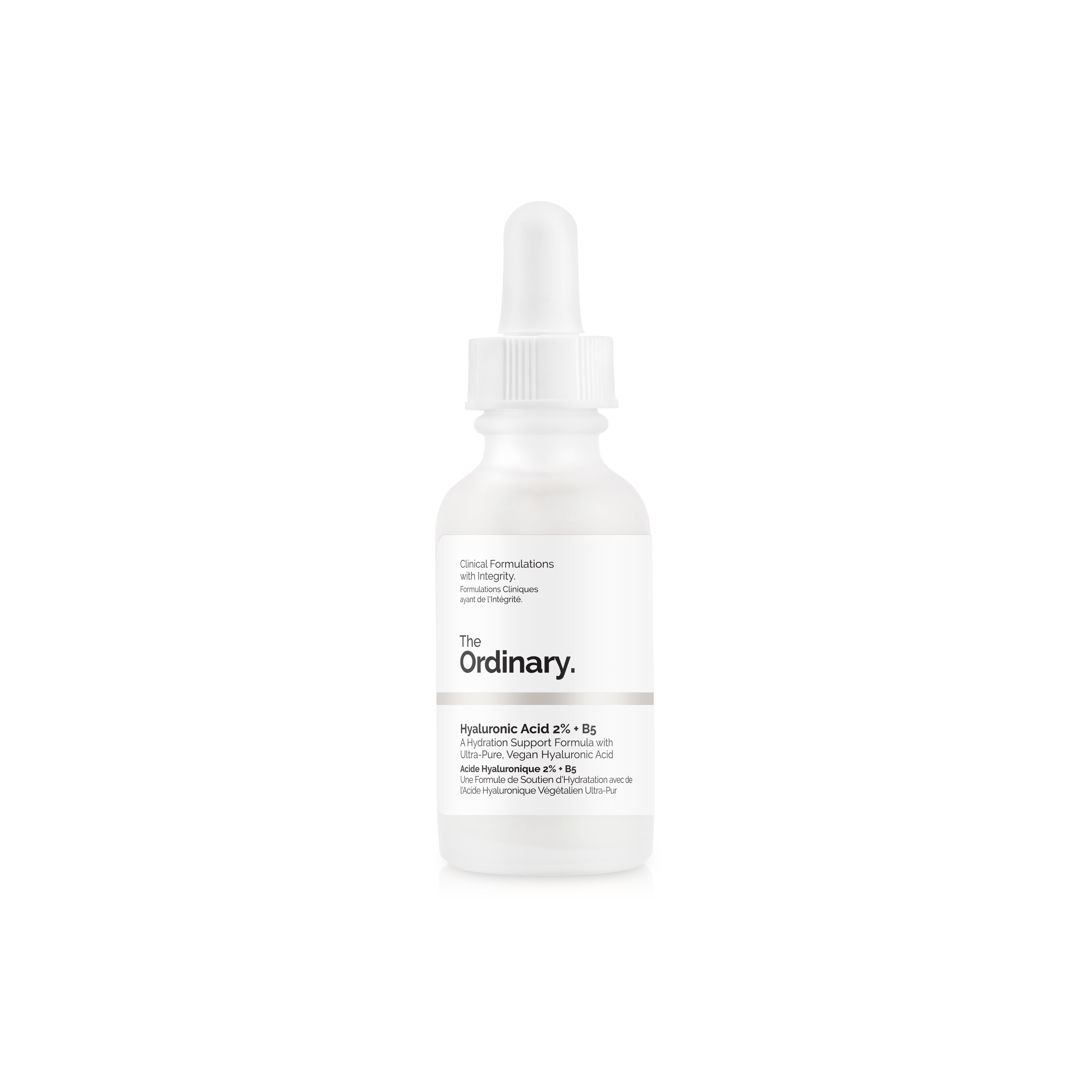 A short cylindrical clear glass bottle full of some bright white liquid with a white pipette lid and a white label that has The Ordinary Hyaluronic Acid 2% + B5 written in bold black writing on it, on a white background.