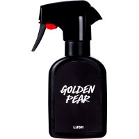 A tall black plastic kitchen spray bottle that has Golden Pear Body Spray written in bold white writing on it, on a white background.