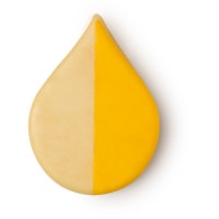 A tear shaped block of bright yellow wax on a white background.