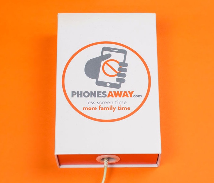 A short rectangular white box that has Phonesaway A Simple Solution To Reduce Your Screen Time written in bold grey writing and a picture of an orange warning sign on it, on a white background.