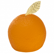 A large circular orange shaped block of bright orange soap with a bright green leaf on top of it, on a white background.