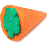 A large bright orange carrot shaped bubble bar that has a large light green shamrock embedded in the top of it, on a white background.