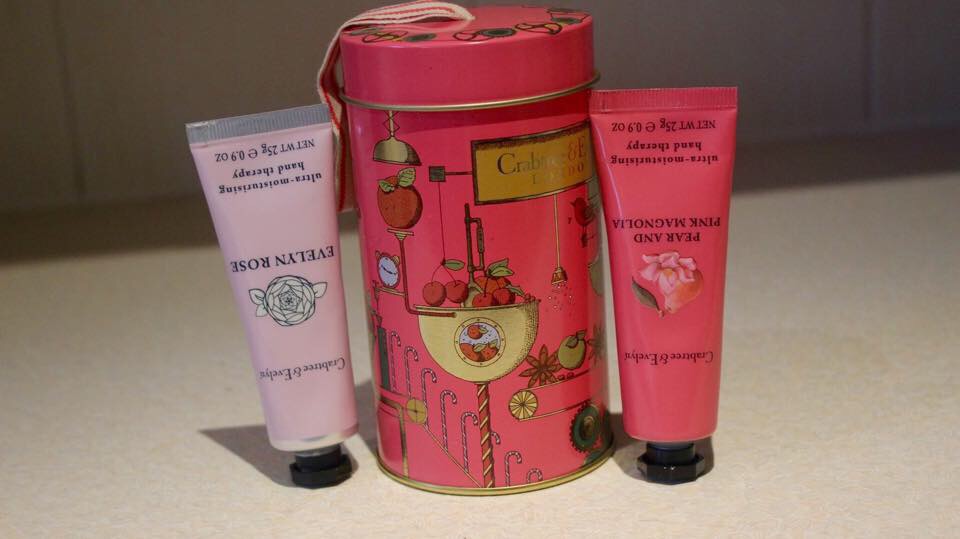 High End Hands | Crabtree & Evelyn Hand Therapy Ornament Tin a small tin with two hand cream tubes inside.