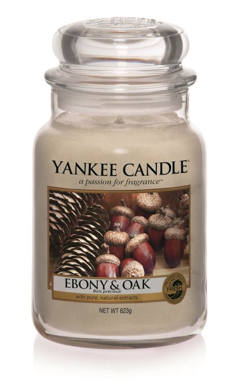What I Thought of the Yankee Candle Advent House 2014 A tall glass jar full of cream coloured wax, with a label with a picture of some acorns and wood with Ebony & Oak written on the label, on a white background.