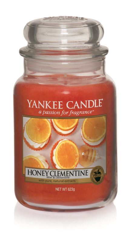What I Thought of the Yankee Candle Advent House 2014 An Orange candle in a tall glass with pictures of sliced oranges with Honey Clementine below it on a white background.