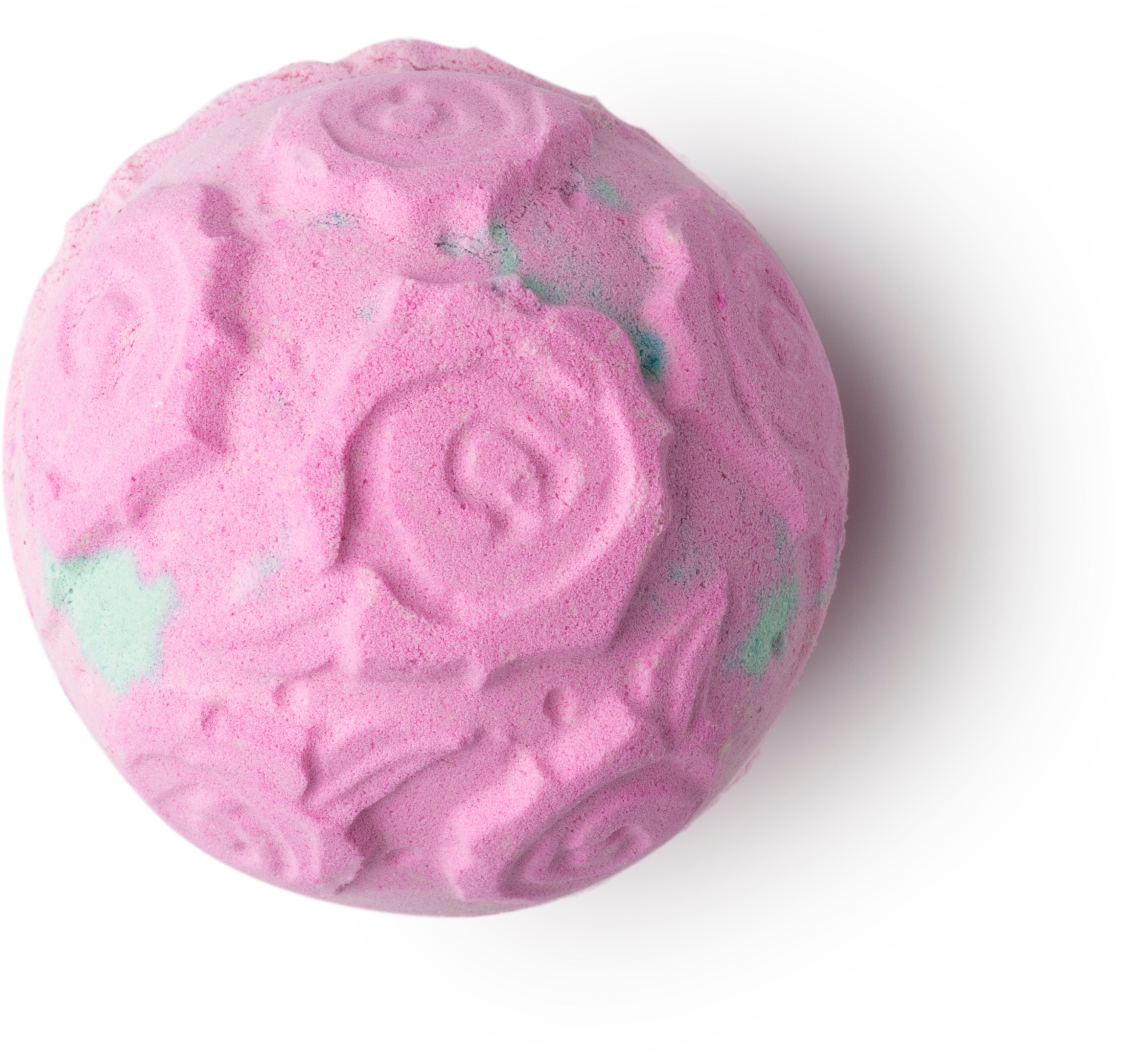 A light pink circular bath bomb with engraved roses all over it, on a white background.