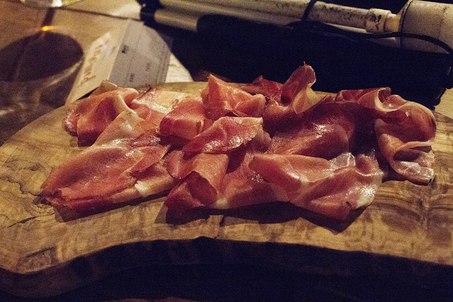 Sweet, Sugar, Candy Man! | Smith & Sinclair Leeds Pop Up Store Launch with The Alchemist Trinity Leeds Some slices of Light Pink Smoked Ham on a wooden board, on a dark background.