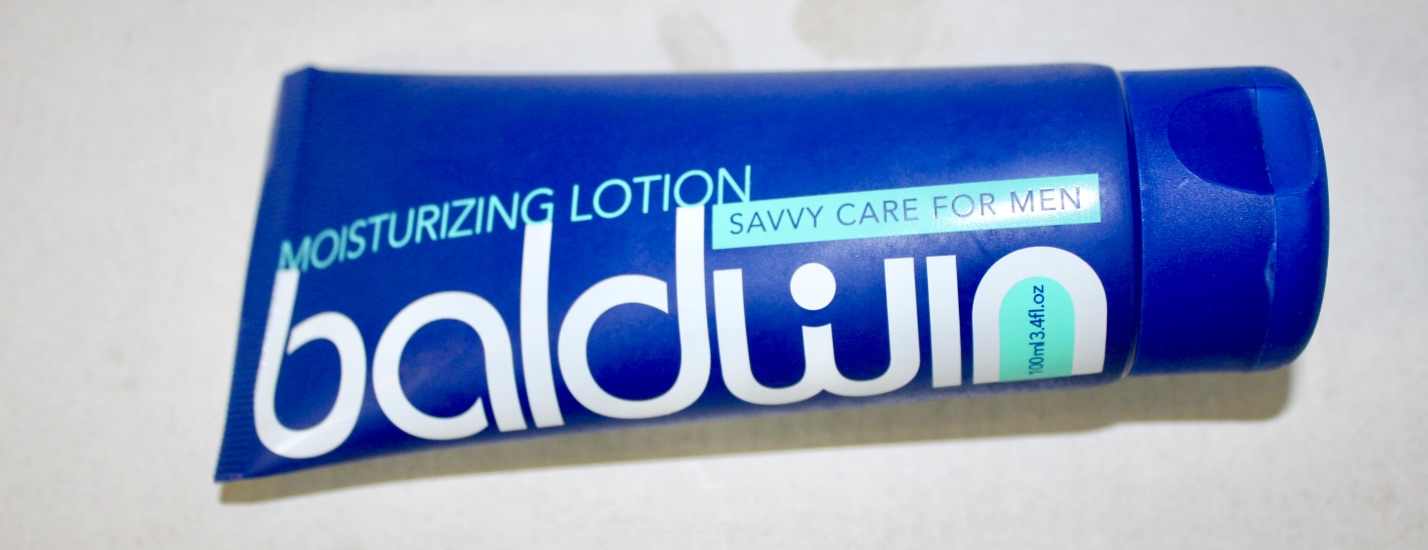 Caring For An Ageing Face | Baldwin Men care Anti Ageing Face Cream For Men A laid down blue cone shaped bottle that has moisturising lotion written in light blue writing and savvy care for men written in black writing on it, in a light blue box, on a white background.