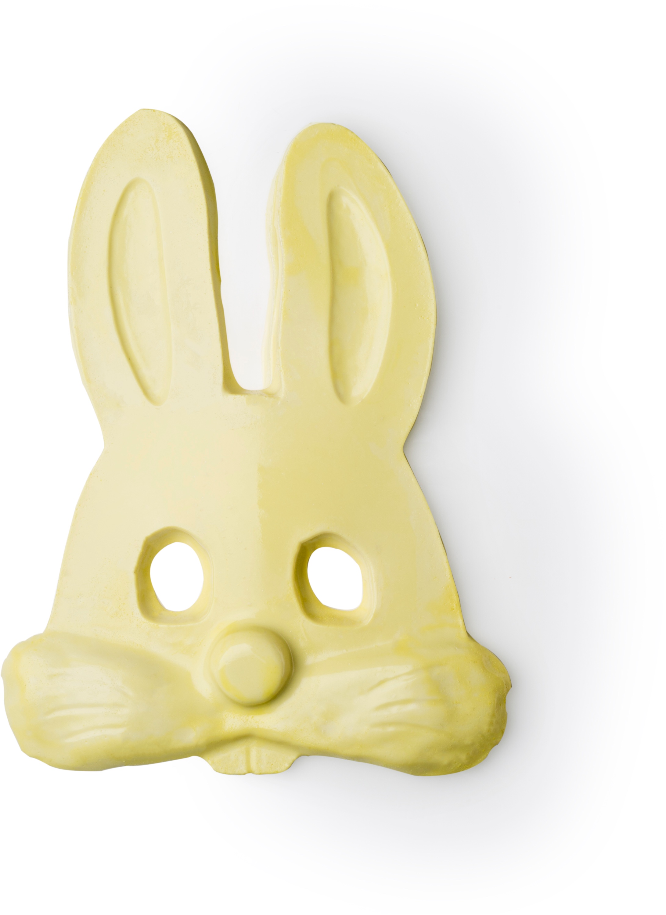 A piece of bright white shower jelly in the shape of a Rabbit's head, on a white background.