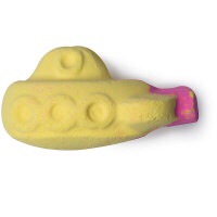 A long rectangular bright yellow boat shaped bath bomb with a pink tail, on a white background.