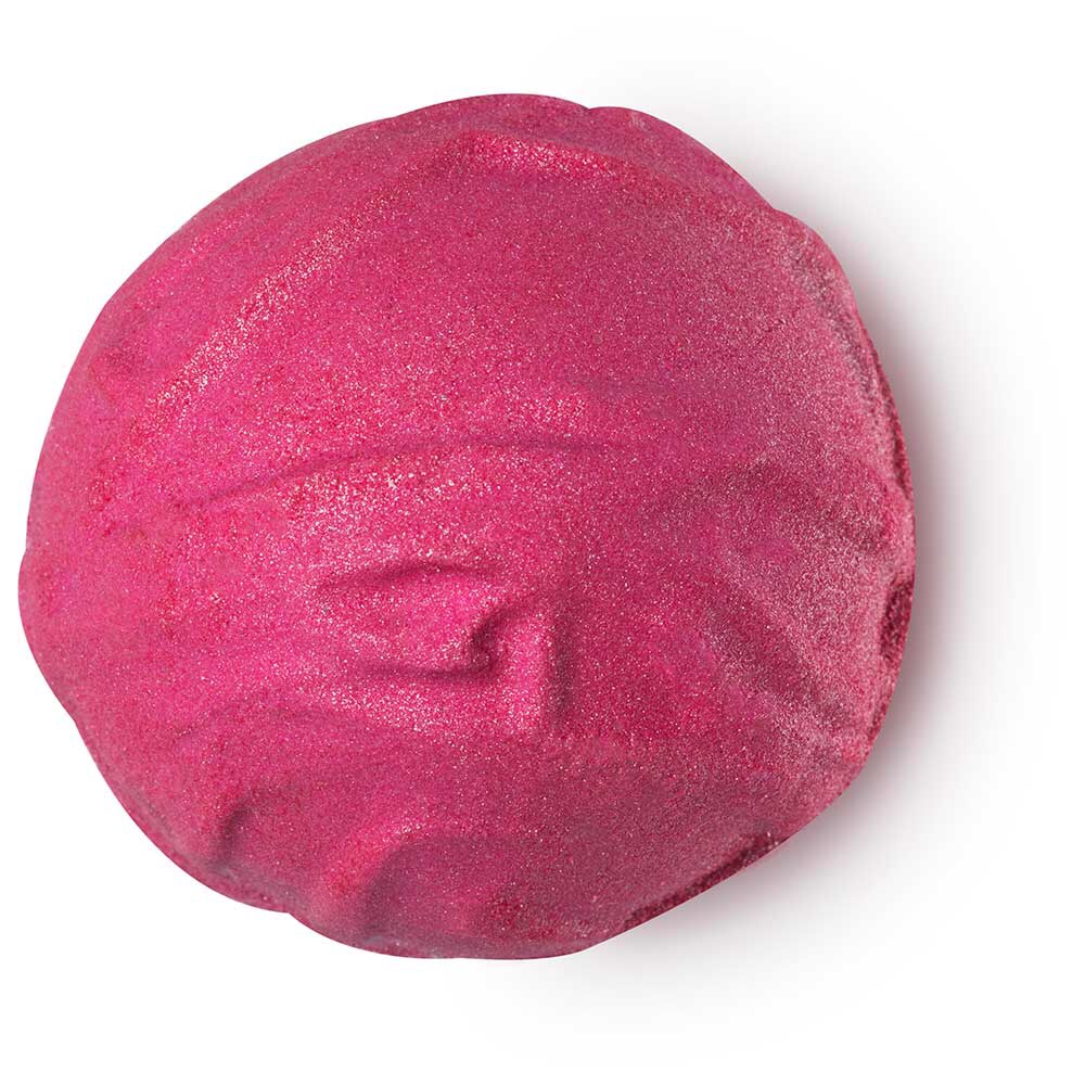 Spring Has Sprung | Lush Spring 2017 Releases A spherical shaped Bright Pink bath bomb with an engraved intricate design and bursts of silver lustre all over it, on a white background.