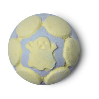 A bright yellow coloured spherical bath bomb with some hexagonal detailing and a ghost engraved on the top of it, on a white background.