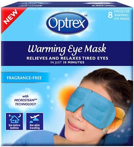 It's In Your Eyes | Optrex Warming Eye Masks A light blue rectangular box that has an oval logo and optrex warming eye masks written in large bold writing and relieves and relaxes tired eyes written in smaller white writing on it next to a woman wearing a light blue eye mask, on a white background.