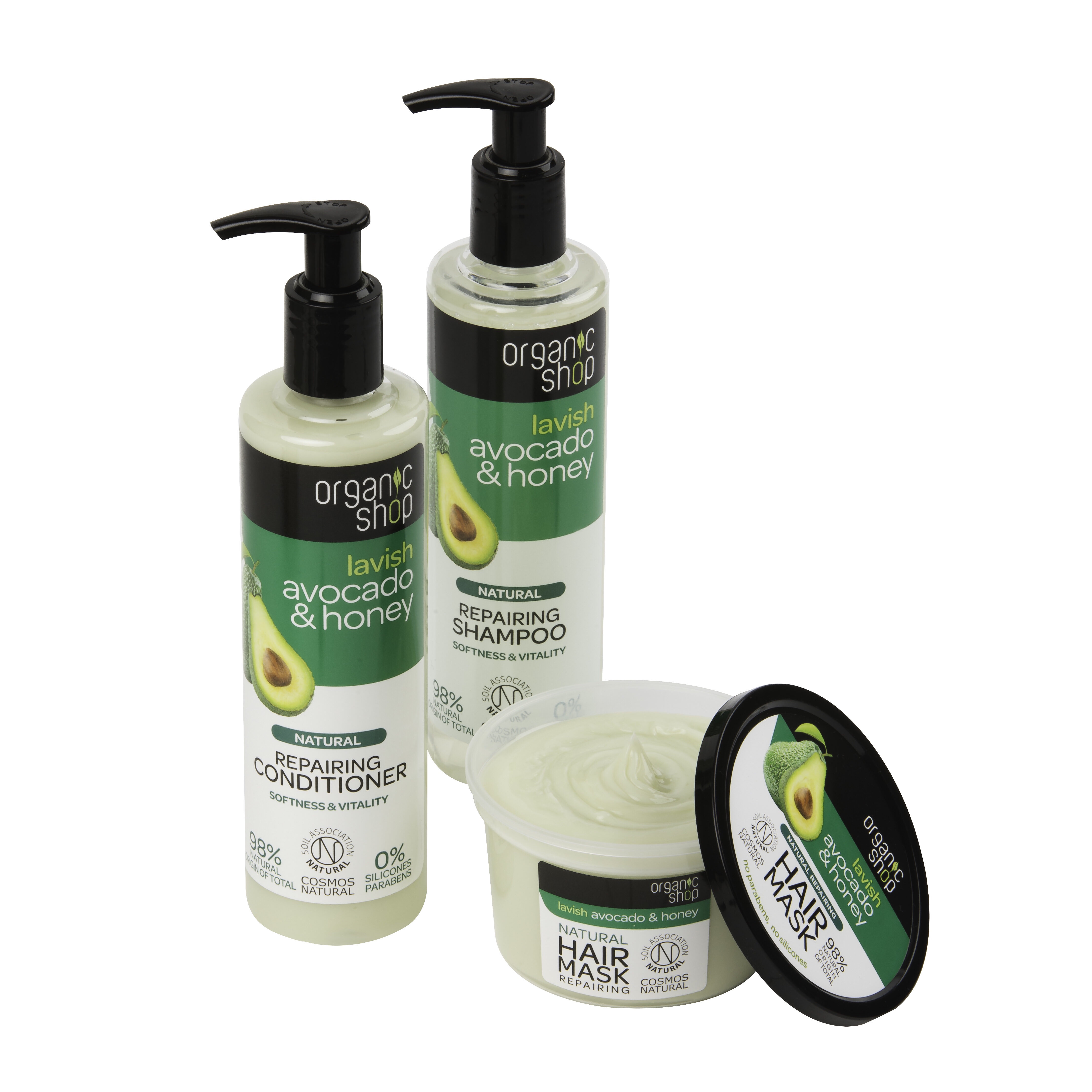 A tall cylindrical plastic bottle full of some white liquid with a black pump and a white and green label that has organic shop lavish avocado & honey natural repairing shampoo written in bold black writing and a picture of half of an Avocado on it, a tall cylindrical plastic bottle full of some white liquid with a pump and a green and white label that has organic avocado & honey natural repairing conditioner written in bold black writing and a picture of half an avocado on it, and a short cylindrical plastic tub full of some white liquid with a black lid and a white and green label that has organic shop lavish avocado & honey natural repairing hair mask written in bold black writing and a picture of half an avocado on it, on a white background.