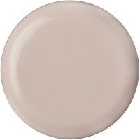 A circular piece of beige coloured jelly, on a white background.
