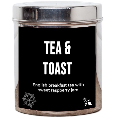 A cylindrical silver tub that has a black sticker with tea & toast written in white writing, english breakfast tea with sweet raspberry jam written in white writing and a picture of some leaves on it, on a white background.