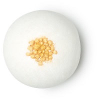 A large spherical white bath bomb that has some Gold Lustre sprinkled on top of it, on a white background.