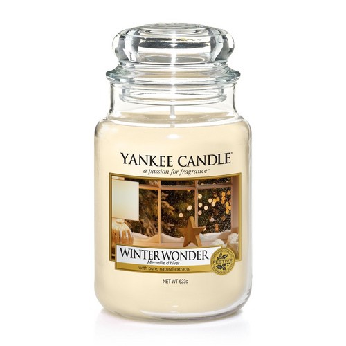 What I Thought of the Yankee Candle Advent House 2014 A tall cylindrical Glass Jar full of some creamy White coloured wax with a label that has Yankee Candle written in black writing, Winter Wonder written in black writing, and a picture of a snowy Winter Window scene on it, on a white background.