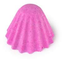 The Comfort Of A Hot Shower | Lush Comfort Zone Shower Bomb, Red Pill Shower Bomb, Supernatural Powers Shower Bomb, & Tantric Energy Shower Bomb A short cylindrical pale pink cone that has some grooves up and down it, on a white background.