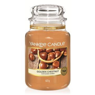 And A Partridge In A Golden Pear Tree | Lush Golden Pear Bath Bomb & Golden Pear Body Spray A tall glass jar full of some dark orange wax with a label that has Yankee Candle written in white writing, Golden Chestnut written in black writing , and some pictures of some Golden Chestnuts on it, on a white background.