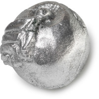A large bright green Apple shaped block of soap that's covered in some bright silver lustre with a dark brown stem and a cut in the middle of it that's filled with some bright white cocoa butter, on a white background.