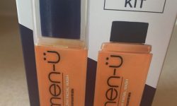 A large rectangular navy and white blue cardboard box that has Men-ü Refill Kit - Healthy Facial Wash written in bold white writing on it, on a white background.