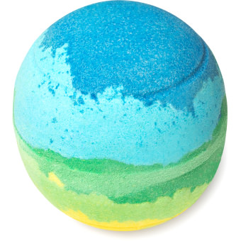 A large bright green spherical shaped bath bomb that has a dark blue splash design on top of it, on a white background.