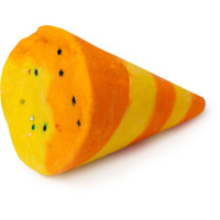 Getting The Party Started In My Bath | Lush 30th Anniversary Bubble Bars A large bright orange and yellow conical party popper shaped bubble bar that has some stars engraved on the bottom of it, on a white background.