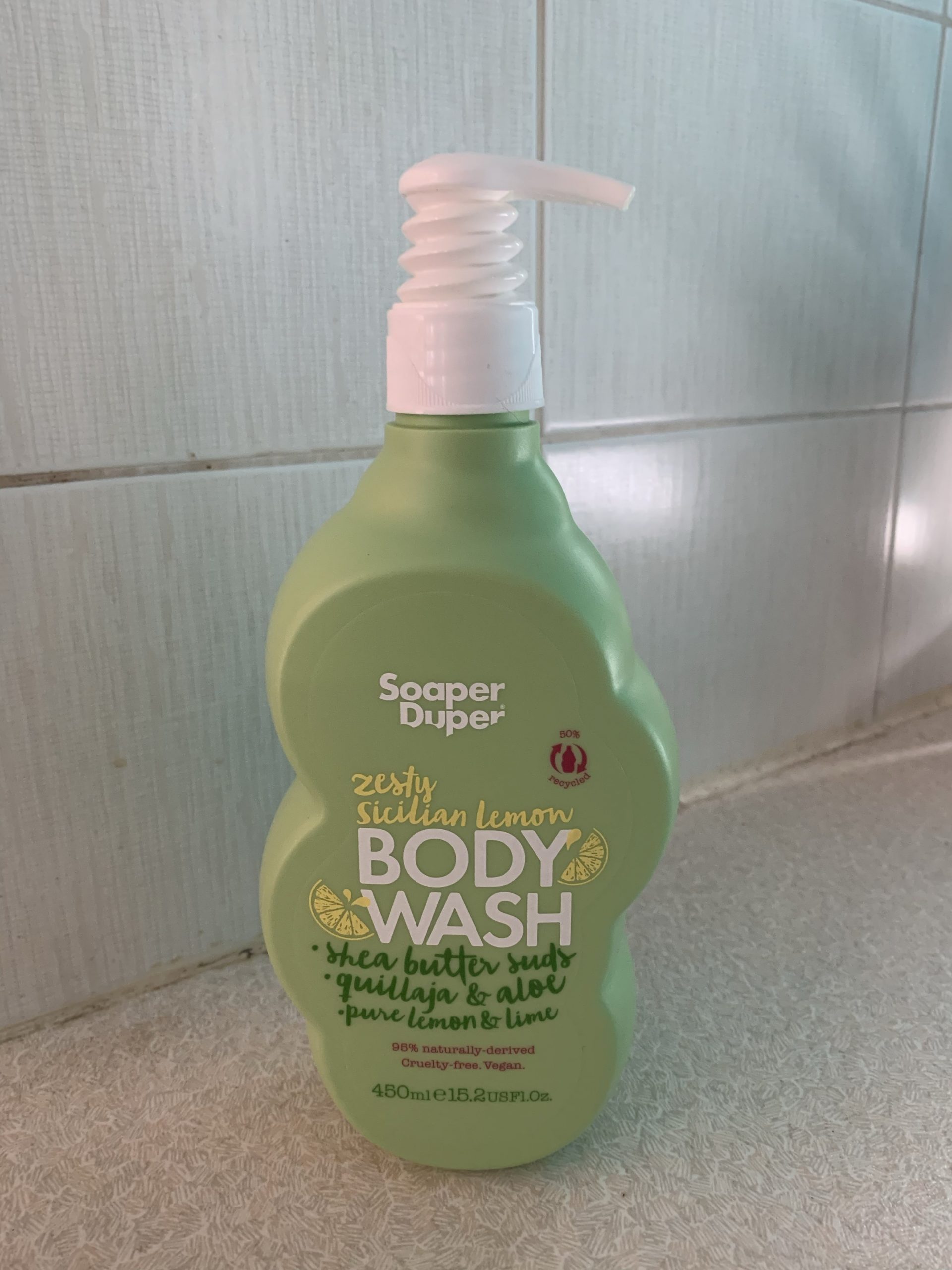 Lemon Beams Are Gonna Find Me | Soaper Duper Sicilian Lemon Range A tall cloud shaped bright green plastic bottle with a white plastic pump lid that has Soaper Duper Zesty Sicilian Lemon Body Wash written in bold white writing on it, on a white background.