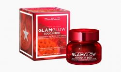 A short cylindrical bright red glass jar with a bright red lid that has Glam Glow Good In Bed™ Passionfruit Softening Night Cream written in bold white writing and a picture of a bright white star on it next to a bright red octagonal shaped cardboard box that has Glam Glow Good In Bed™ Passionfruit Softening night cream written in bold white writing on it, on a white background.