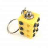 A small rectangular plastic twistable cube keyring that has some brown braille dots on it and a silver metal keychain attached to the top of it, on a white background.