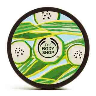 A short cylindrical dark green plastic tub with a dark green lid that has The Body Shop Cool Cucumber Body Butter written in dark green writing and some pictures of some bright green cucumbers on it, on a white background.