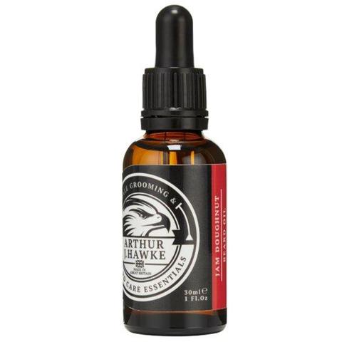 A Beard With A Hole In The Middle | Arthur J Hawke Jam Doughnut Beard Oil A short cylindrical brown glass bottle with a black rubber pipette lid and a white label that has Arthur J Hawke Jam Doughnut Beard Oil written in bold white writing and a picture of a black and white hawk on it, on a white background.