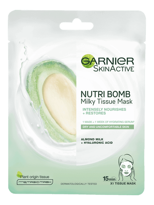 An Explosion Of Nourishment | Garnier Nutri Bomb Almond & Hyaluronic Acid Tissue Mask A tall rectangular bright white plastic pouch that has Garnier written in bold black writing, Nutri Bomb Almond & Hyaluronic Acid Tissue Mask written in smaller black writing, and a picture of a large circular puddle of bright white milk on it, on a white background.