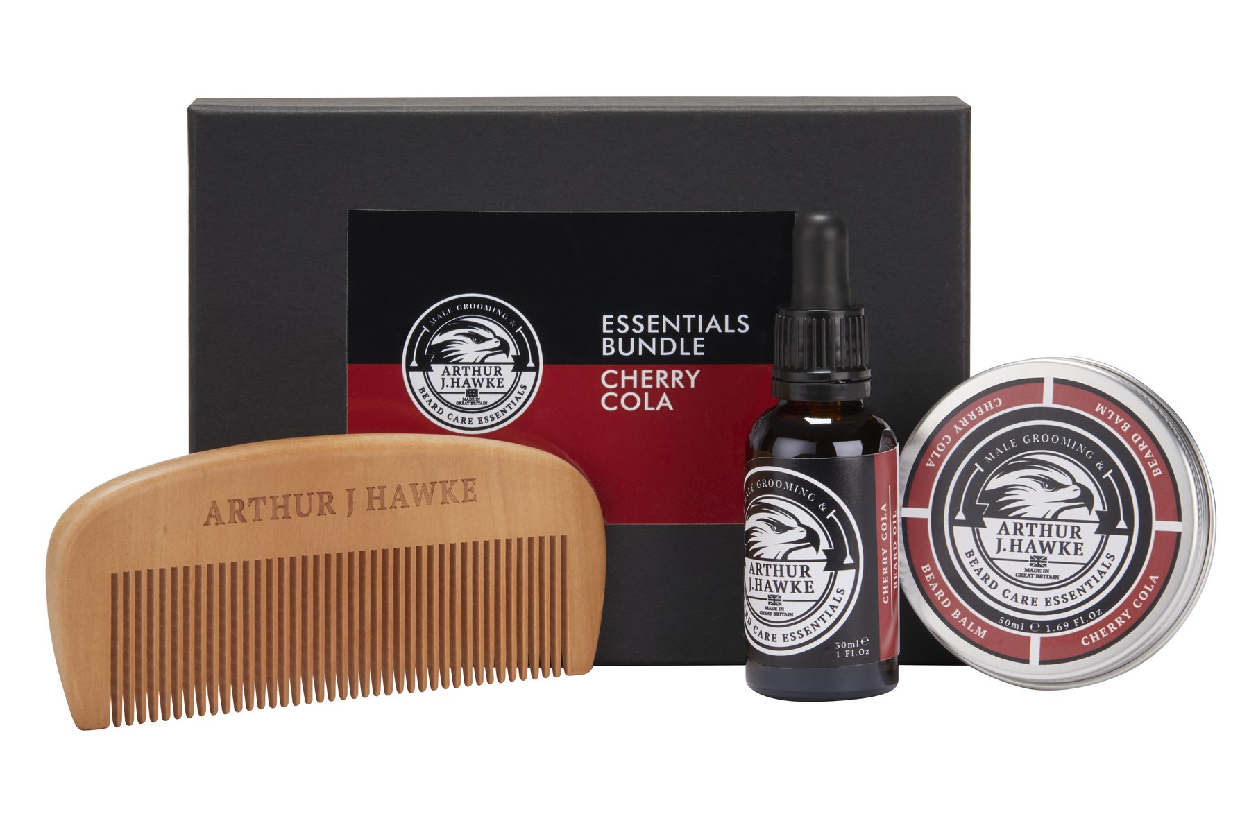 A large rectangular black cardboard box that has Arthur J Hawke Cherry Cola Essentials written in bold white writing on it next to a large dark brown semicircular beard comb , a short rectangular brown glass bottle with a black rubber pipette lid and a black label that has Arthur J Hawke Cherry Cola Beard Oil written in bold white writing on it and a short cylindrical metal tin with a black label that has Arthur J Hawke cherry cola beard balm written in bold white writing on it, on a white background.