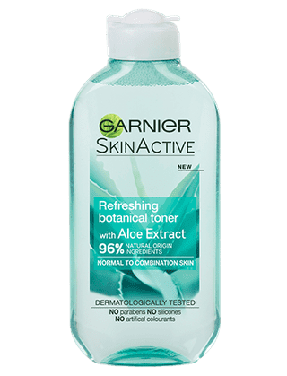 A tall flat cylindrical white plastic bottle with a white plastic lid that has Garnier Naturals written in bold black writing, Aloe Extract Toner For Normal Skin written in bold white writing, and a picture of a dark green aloe vera plant on it, on a white background.