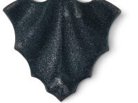 A large dark purple bat shaped bath bomb that has some silver lustre on top of it, on a white background.