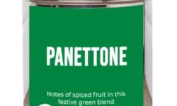 A short cylindrical silver metal tin with a black label that has bird & blend tea company Panettone Loose Leaf Tea written in bold white writing on it, on a white background.