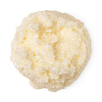 Get Out Of My Way Or Get Hit With A Cane A medium circular puddle of creamy white lip scrub that has some pieces of extra fine sea salt in it, on a white background.