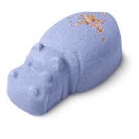 A small bright purple hippopotamus shaped bath bomb that has some silver lustre on top of it, on a white background.