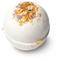 a small bright white spherical shaped bath bomb that has some different coloured flower petals embedded on top of it, on a white background.