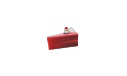 A large triangular bright red slice of cake shaped block of soap that has a layer of bright white cake frosting and a bright red 3D Santa figurine on top of it, on a white background.